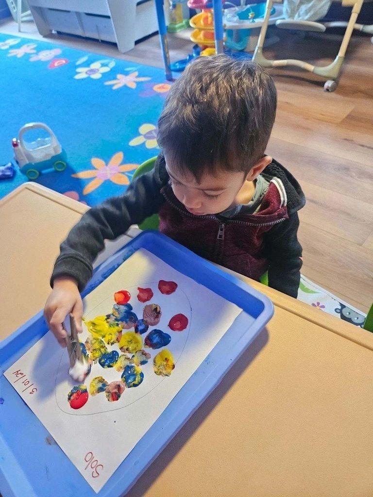 Toddlers exploring sensory play activities