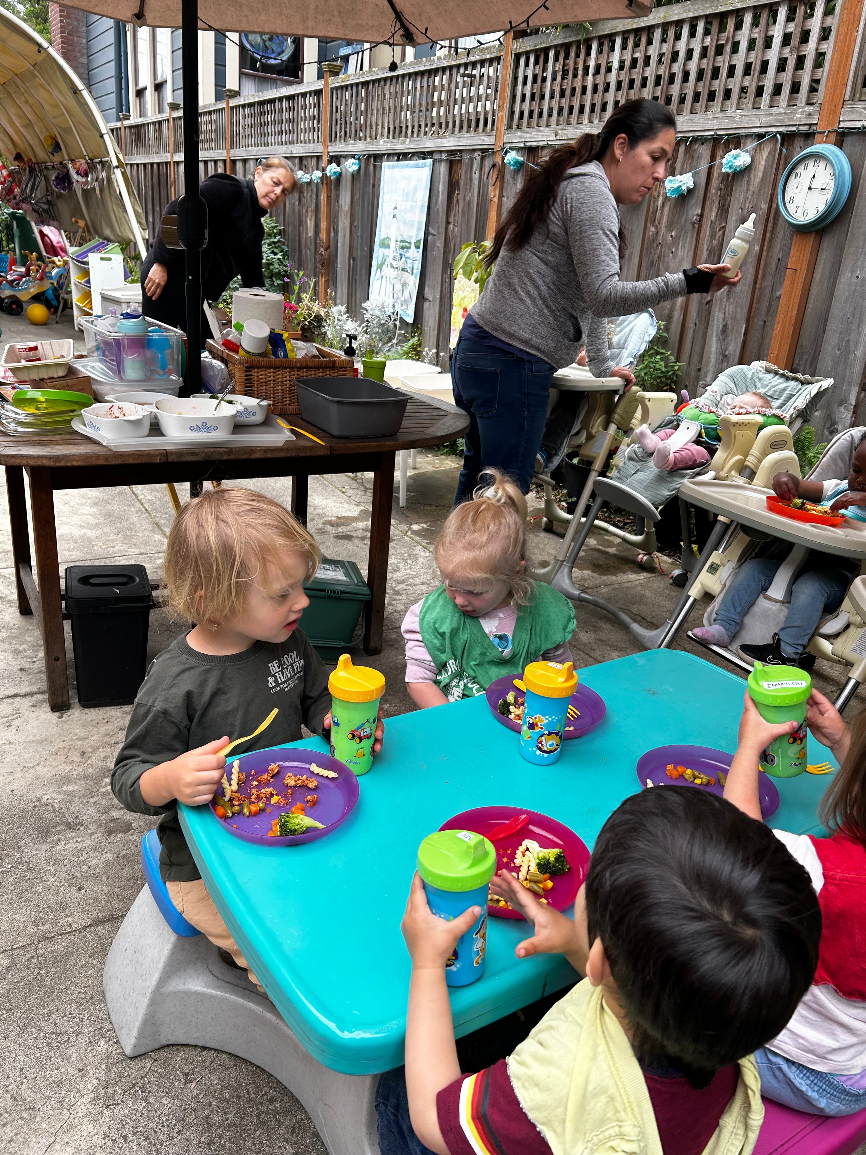 Children enjoying a meal together at Little Crumbles